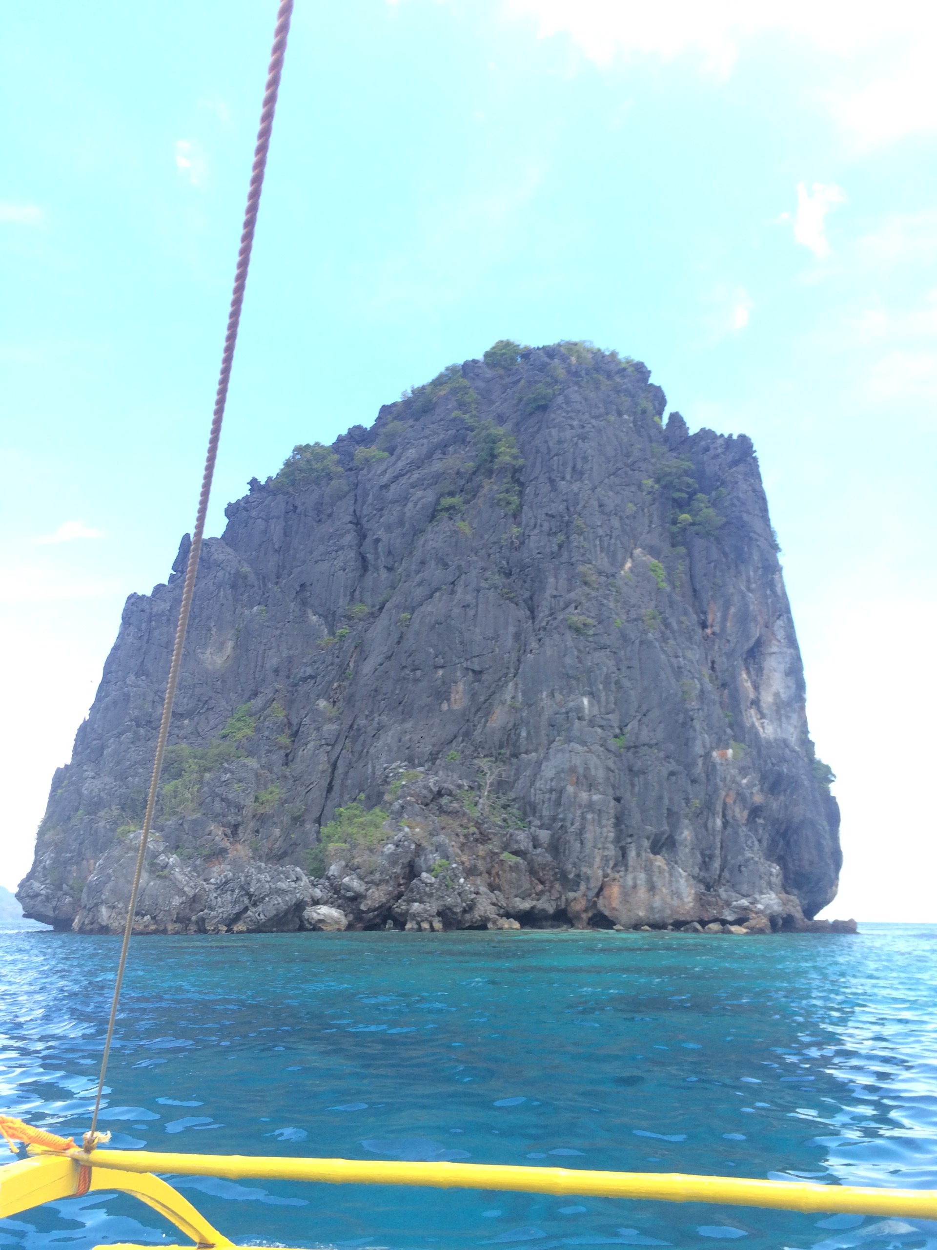 From afar, we make our way closer to this rock formation. We will make a dive by this rock and then head to another spot.