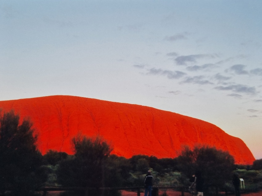 When I was guiding, there were two main tours I would do out to Uluru. One was a walk around (almost) the entire base of the rock - that was my favourite. The other was a short drive around, a stop at a big car park to watch the sunrise over the rock, and then a visit to the Mutijulu Visitor Centre, where passengers could learn more about the local Aboriginal culture and buy arts and crafts made by the locals.This is what the rock looks like at sunrise almost every single morning. It was like someone would ’turn the lights on’ all of a sudden and nearly every one of the hundreds and hundreds of tourists would simultaneously gasp at the sight.