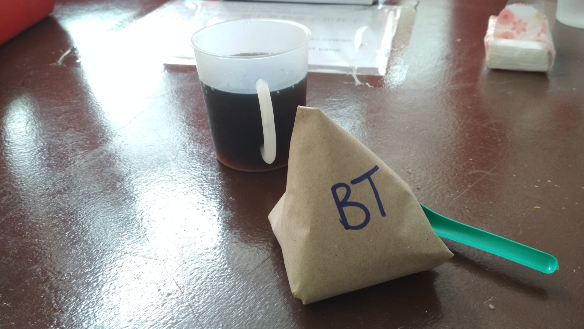 Iced black coffee and a pack of coconut extract fragrant rice