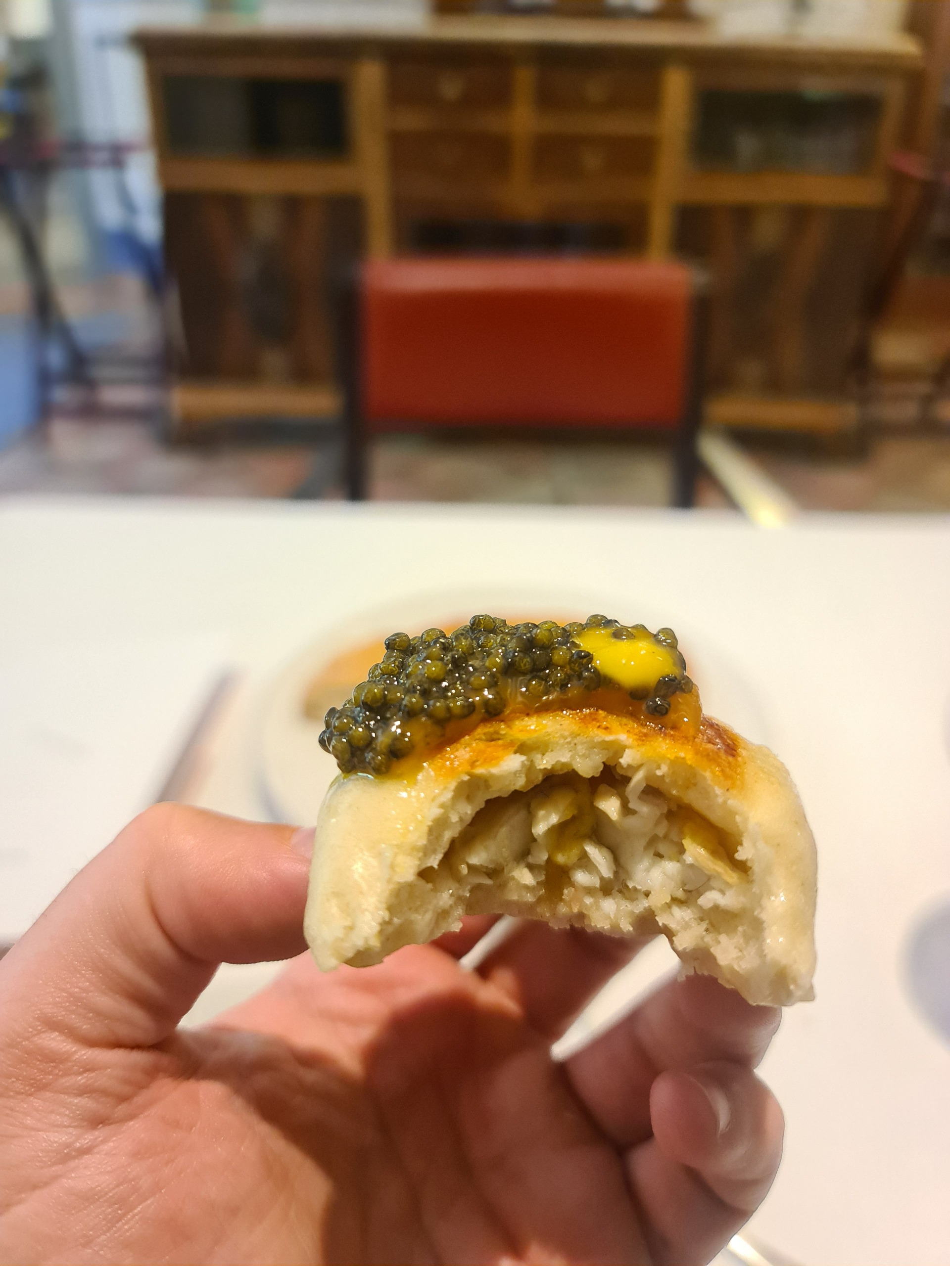 Steamed bun stuffed with eel and topped with black lemon meniere and caviar (Fifht main course) (4).