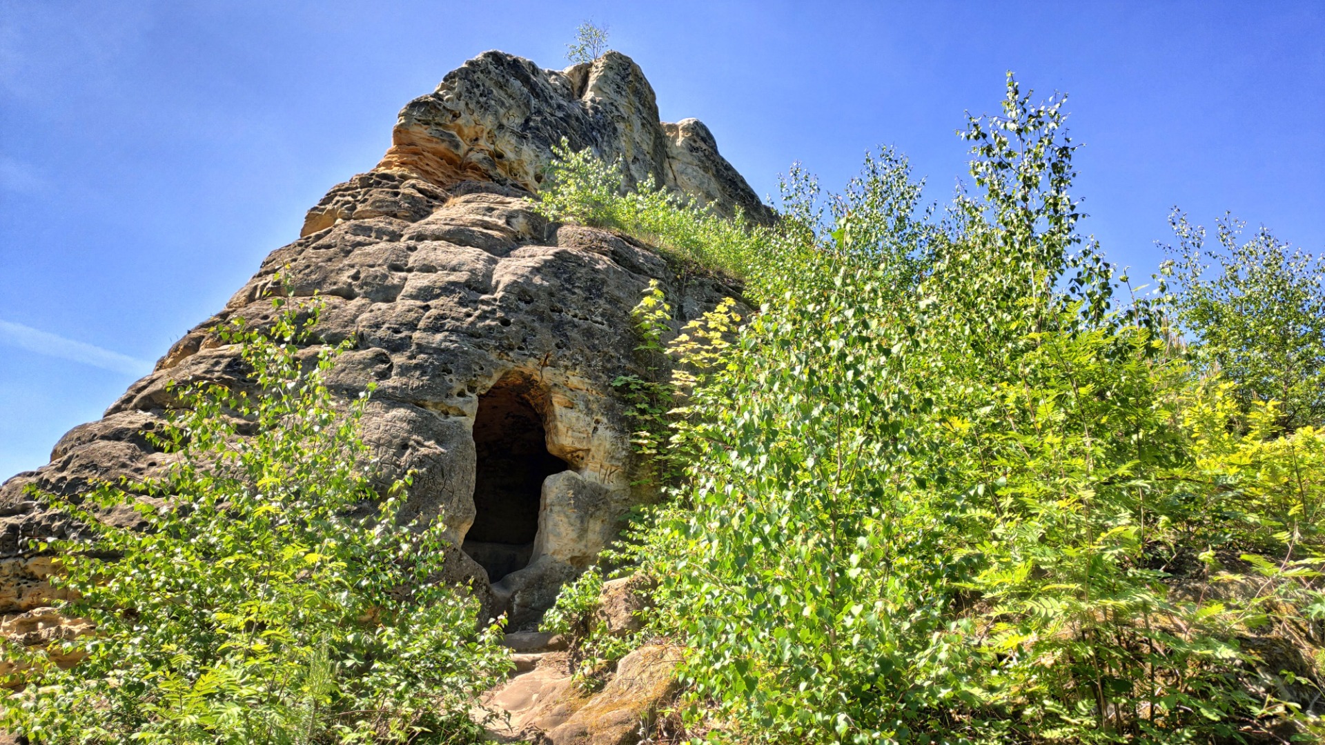 A small cave, maybe made by an monk.