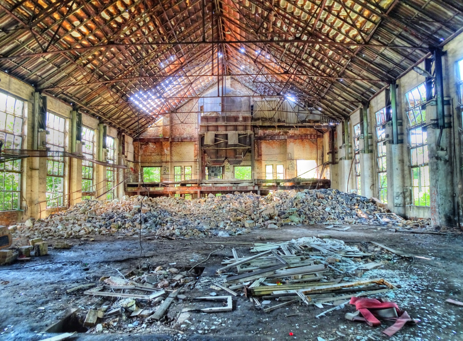 A hall and a lot of broken glass
