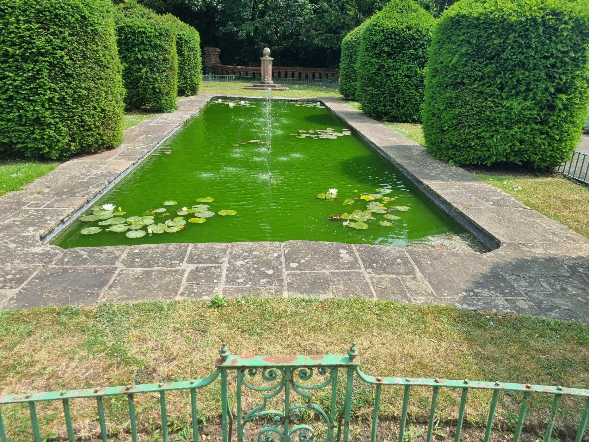 I think the pool maintenance person needs to check the pH levels and add a bit of acid this fountain pool was looking a tad green. I am worried my swimming pool will look similar when I get home from this trip.