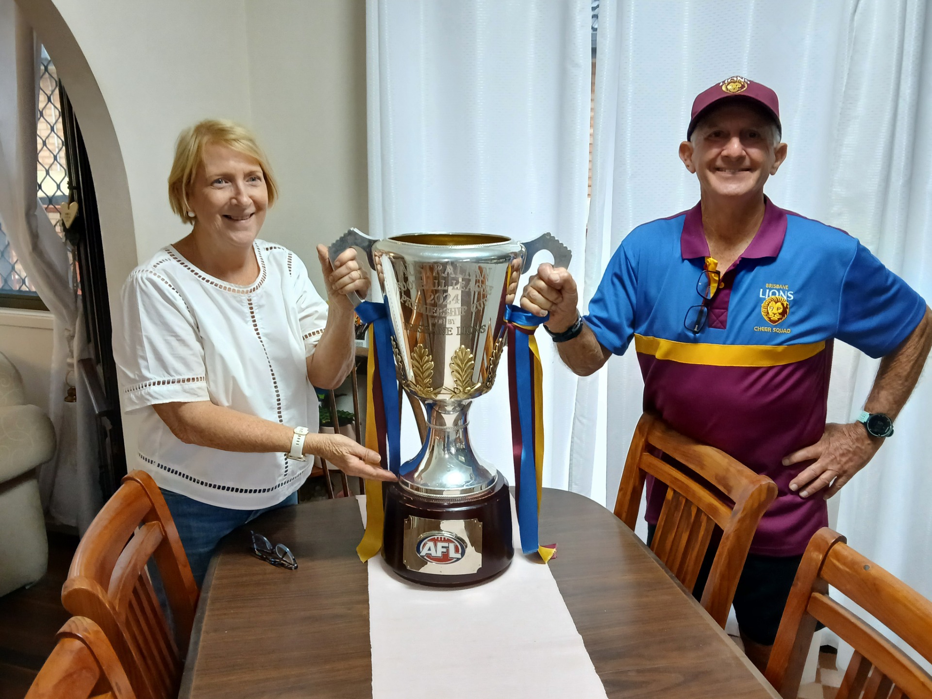 My wife and I with Premiership cup on our kitchen table