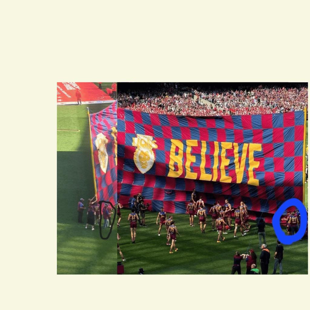 Raising the banner Me and daughter left and son in law right (merged photo)