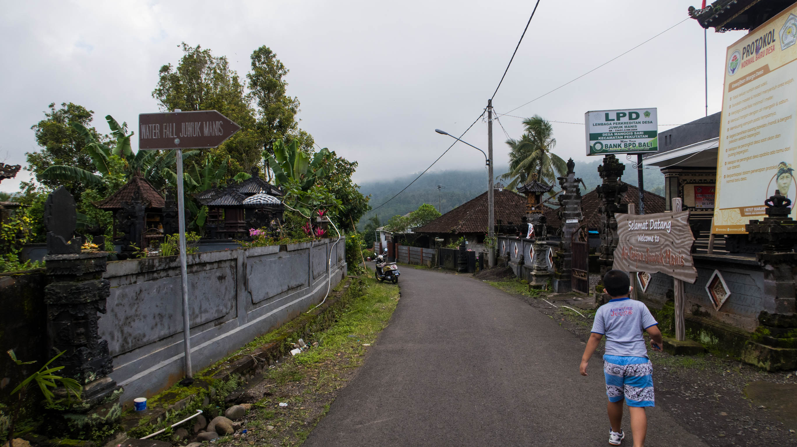 The sign says Waterfall Juwuk Manis to the right.