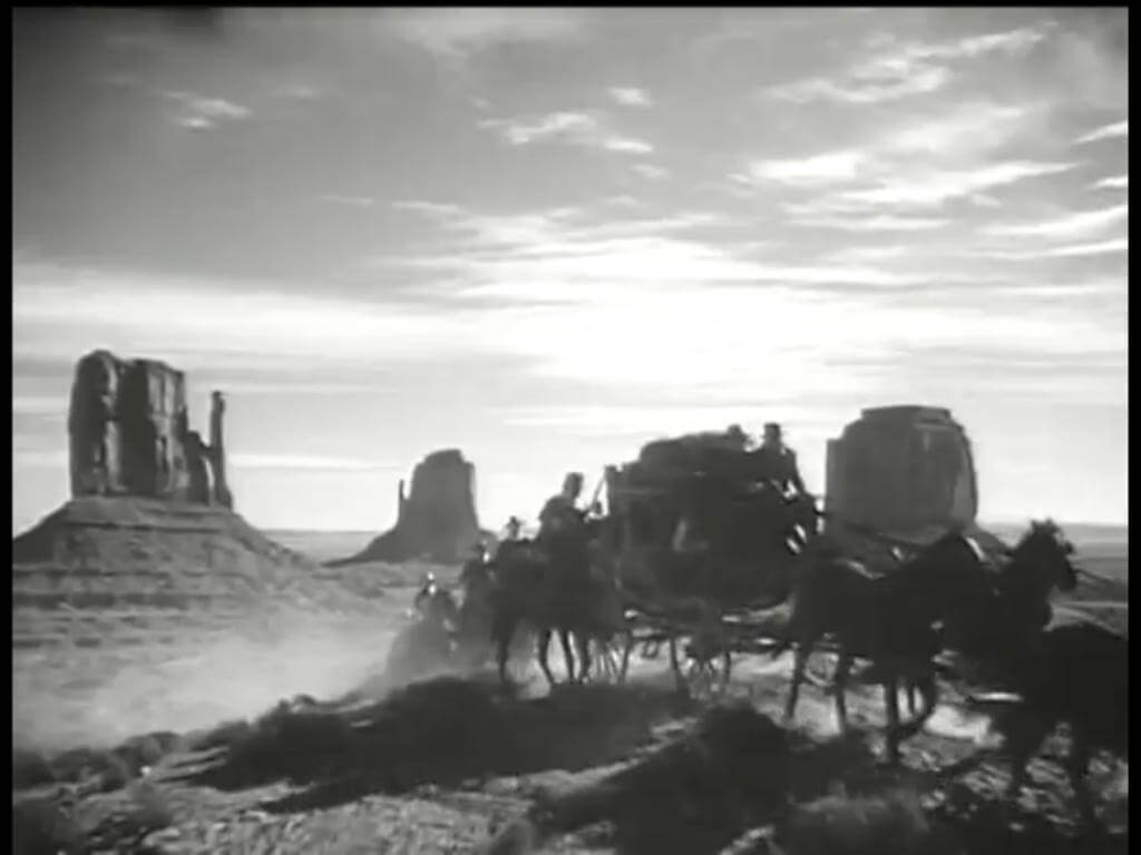 A Shot from ’Stagecoach’, 1939. (Source: https://wheninyourstate.com/arizona/10-movies-youve-seen-monument-valley/)